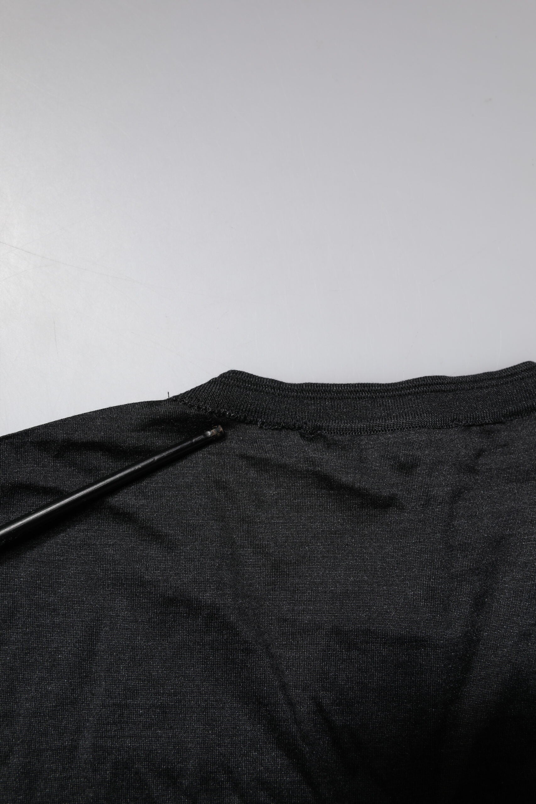 Black fabric with a zipper on the front