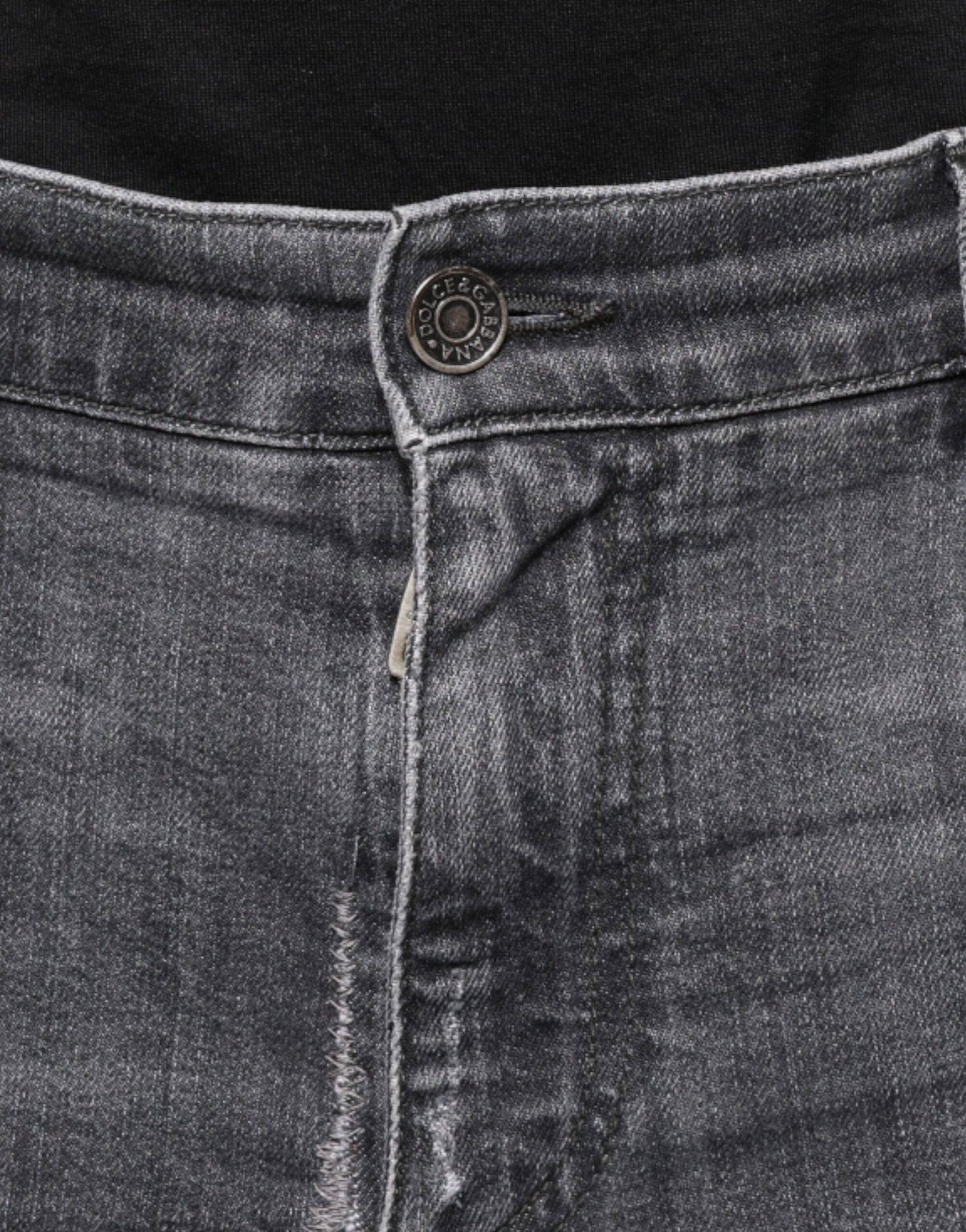 Blue denim jeans with button closure