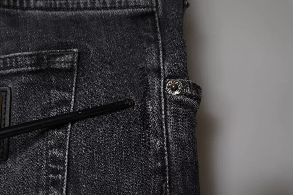 Pair of blue jeans with button closure