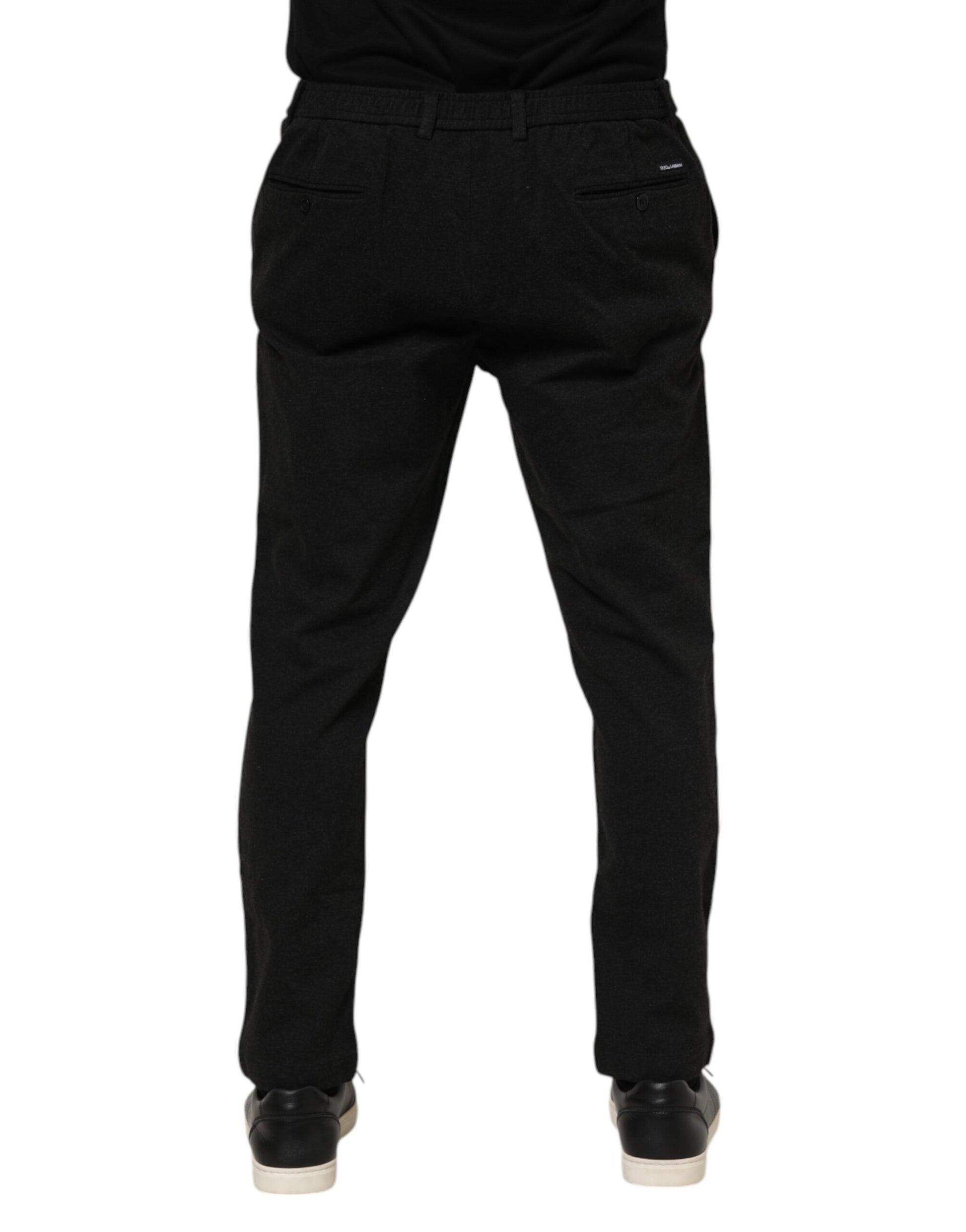 A pair of dark gray men's trousers made from viscose fabric