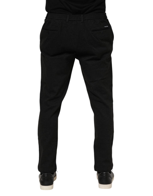 A pair of dark gray men's trousers made from viscose fabric