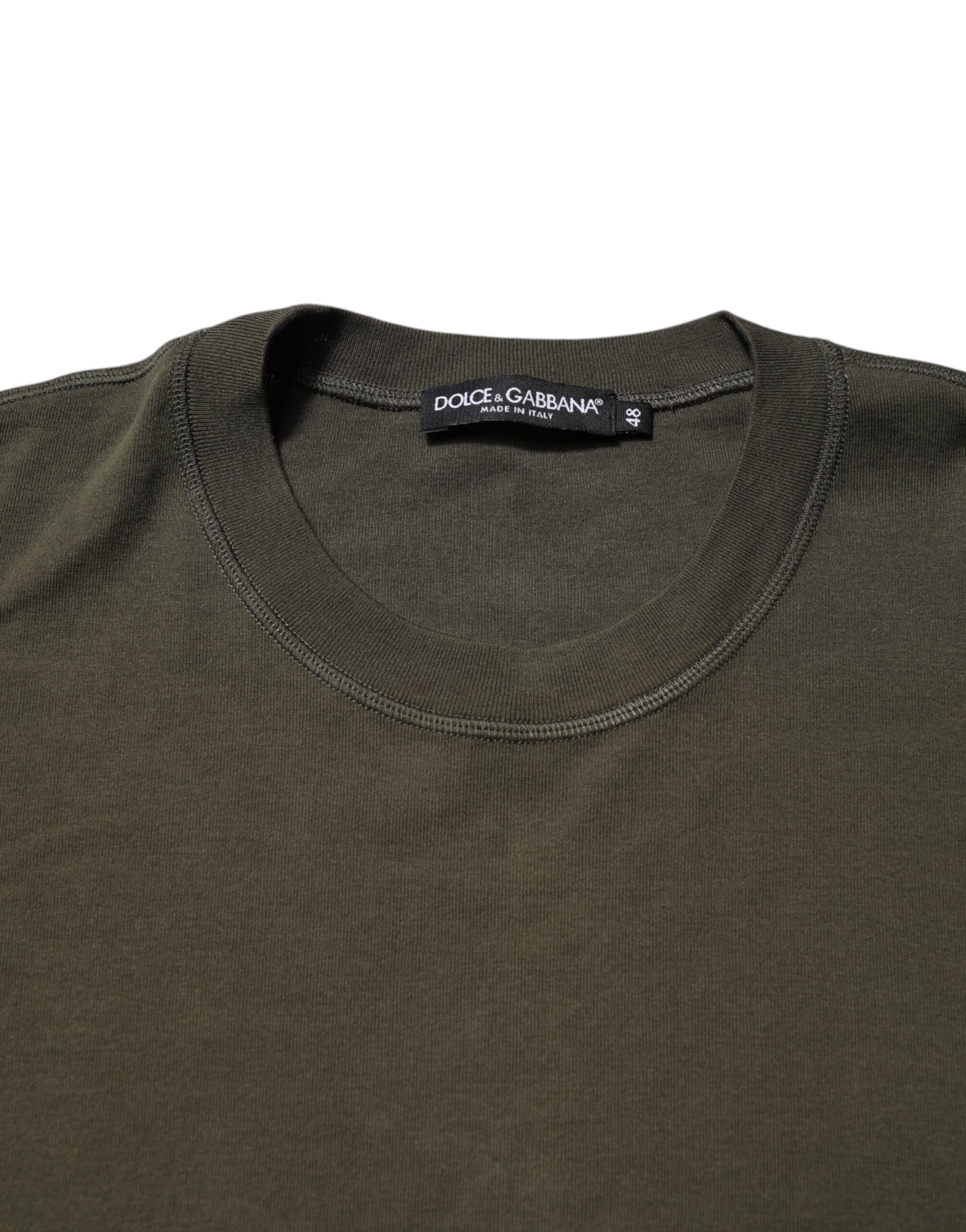 Green crew neck t-shirt on hanger