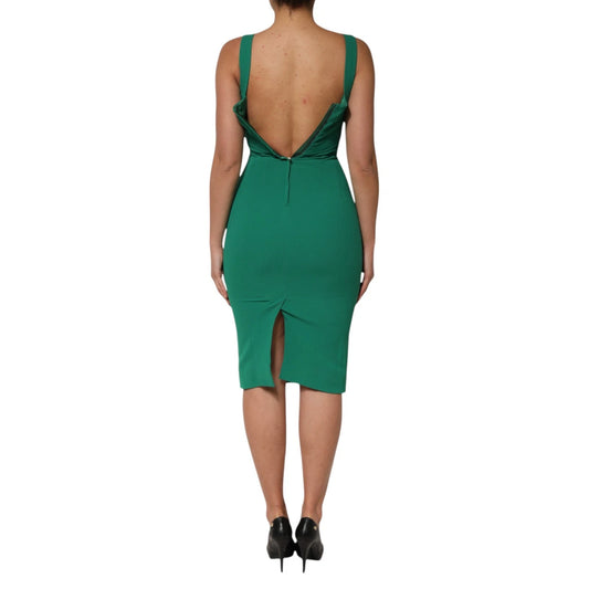 A sleeveless, dark green bodycon dress with a high slit on the back