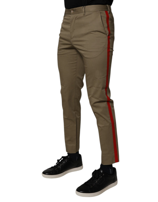 Pair of brown trousers with red stripe down side