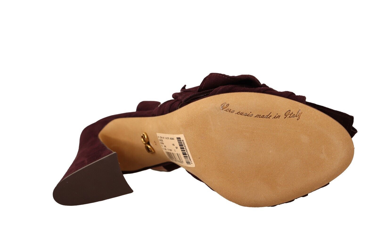 A brown leather guitar strap with a label on it