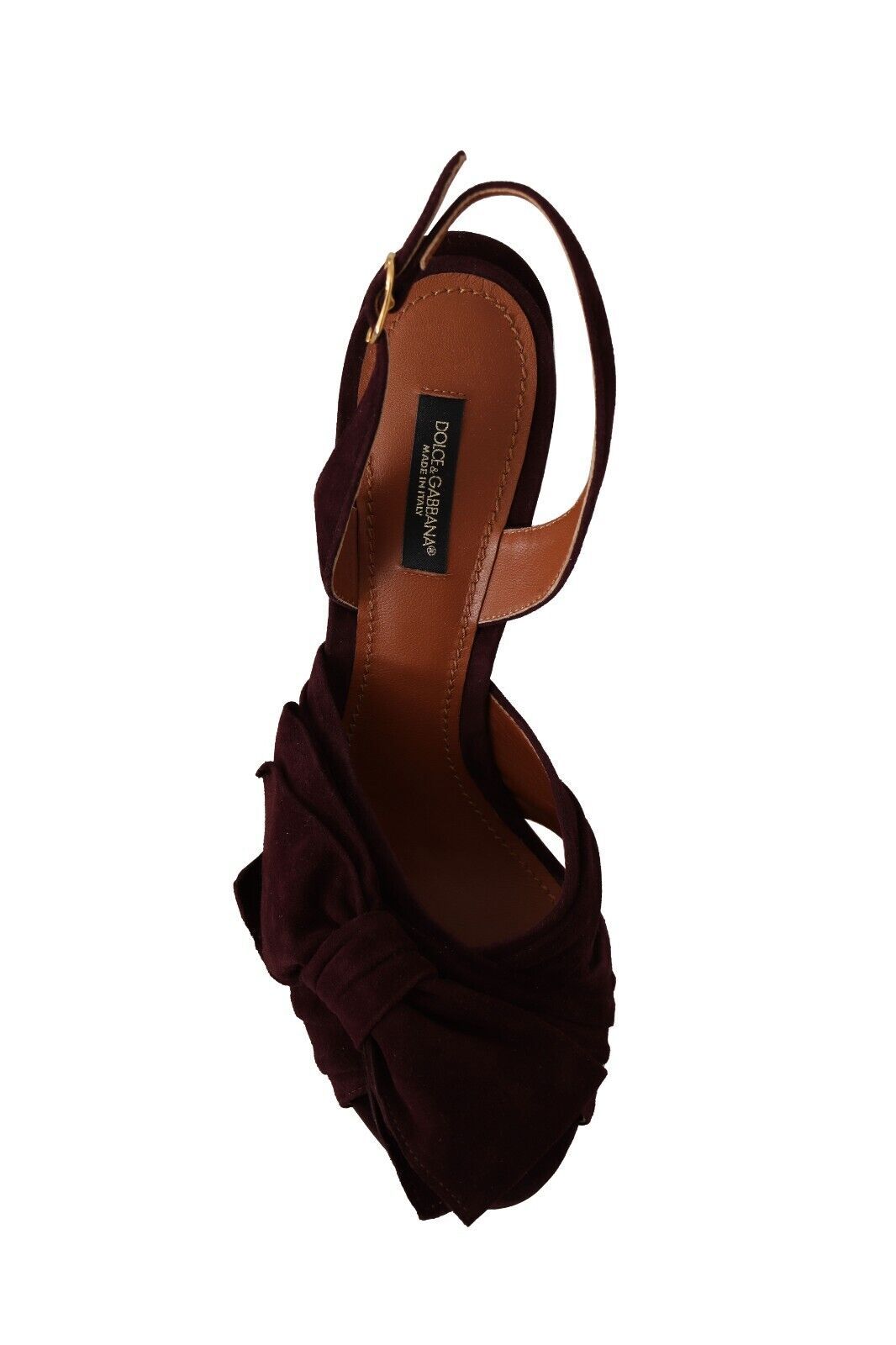 Brown leather sandal with a black label on it