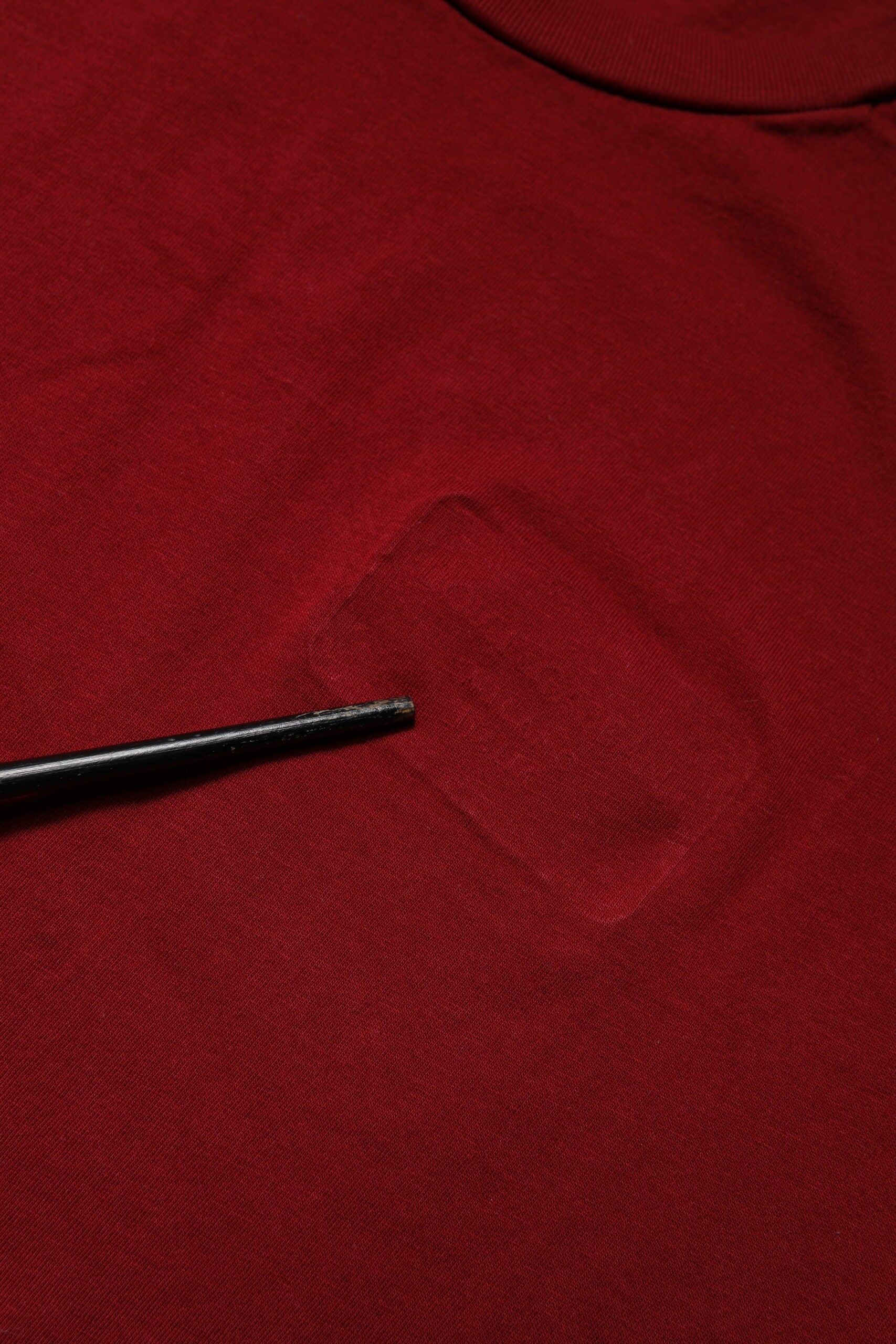 Red shirt with hole in front