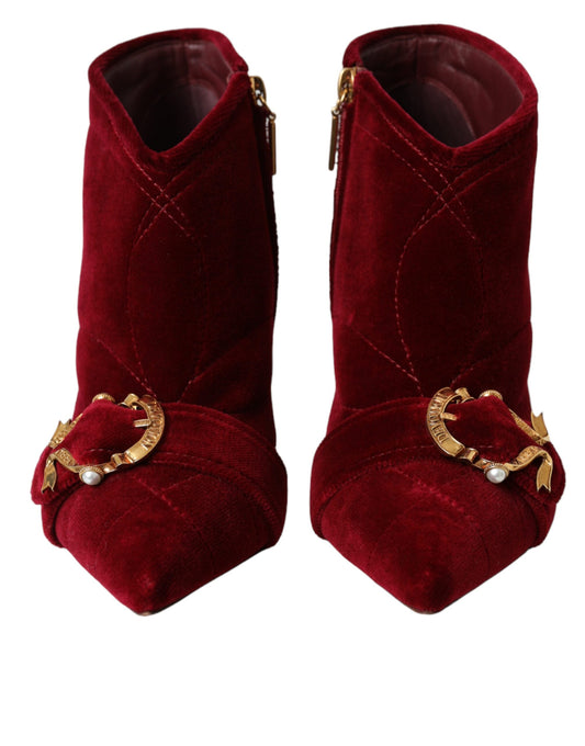 Pair of red velvet boots with gold buckles