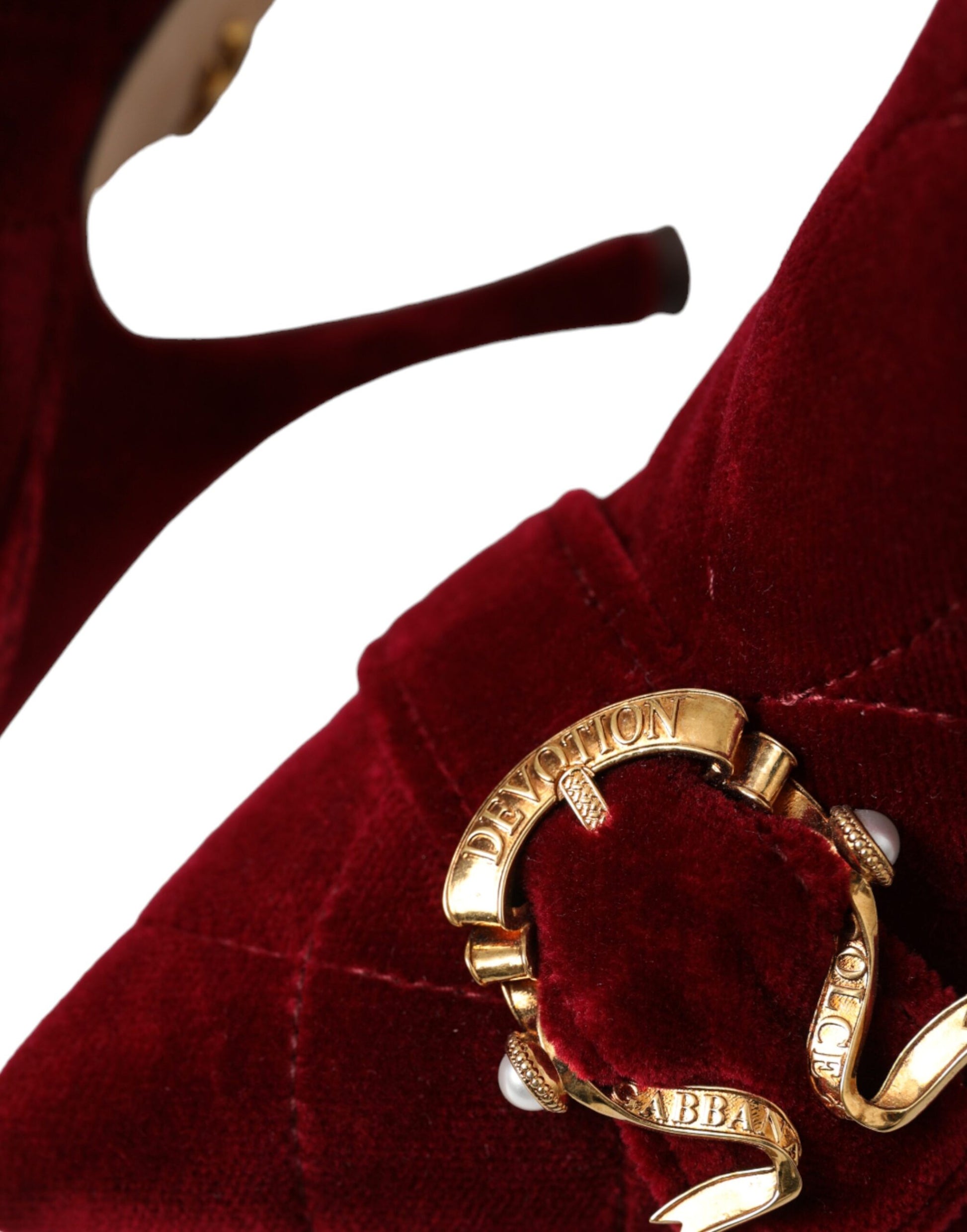 Gold ring on red fabric