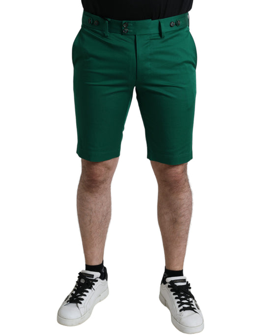 Man wearing green shorts and black shoes