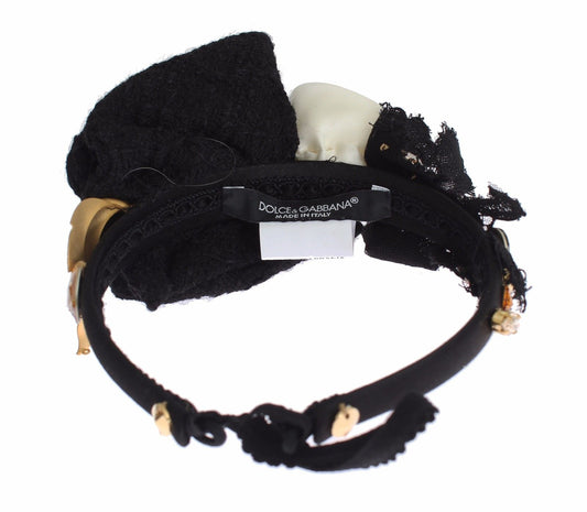 Black bracelet with gold accents and a tag