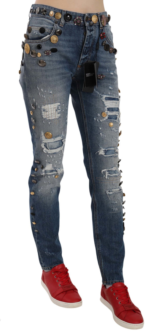Pair of distressed denim jeans with embellishments on legs