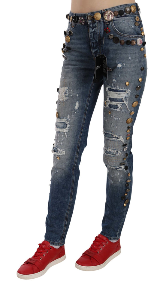 Pair of distressed denim jeans with studs and rips