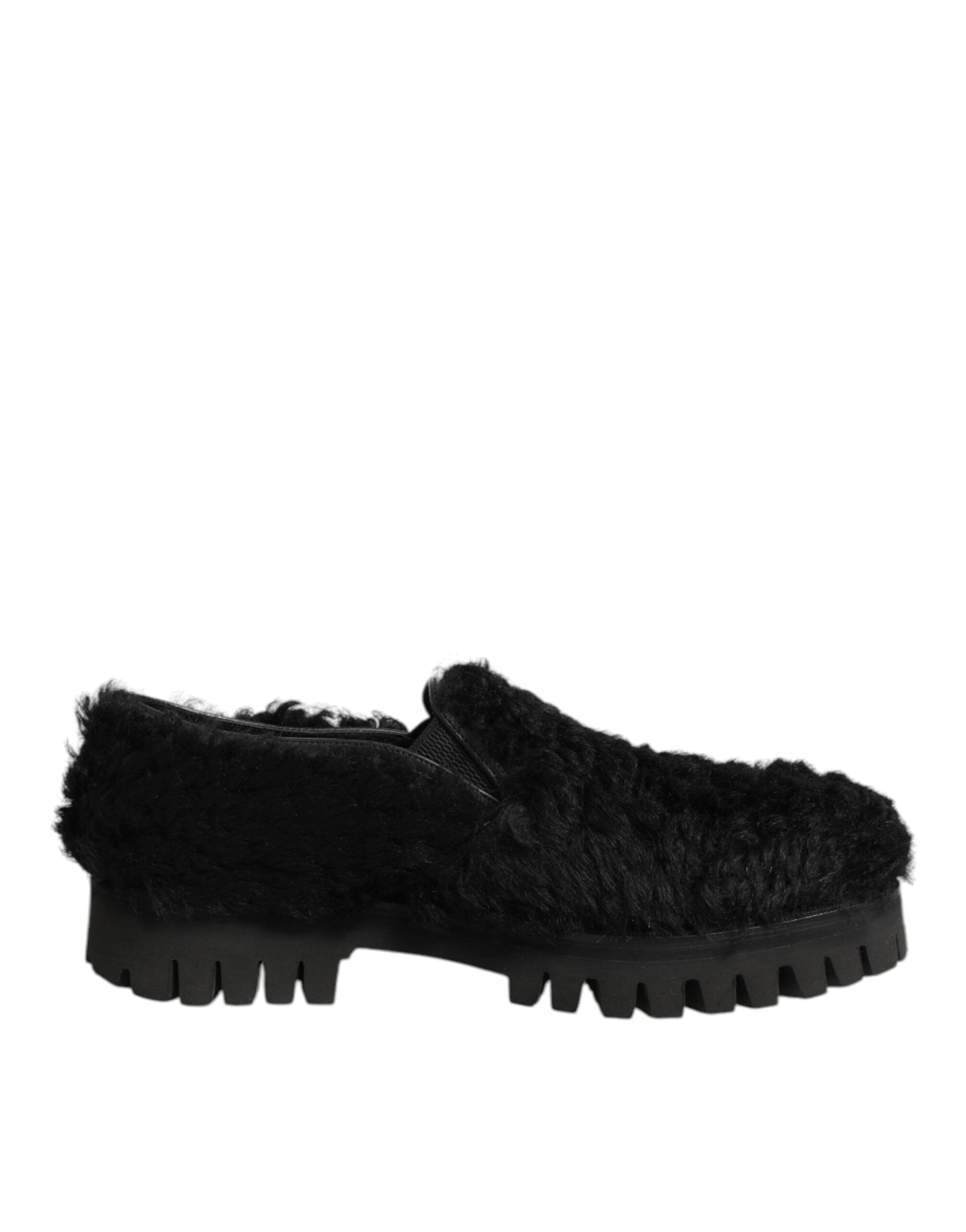 A pair of black fur-lined leather shoes with a chunky sole, designed by Dolce & Gabbana