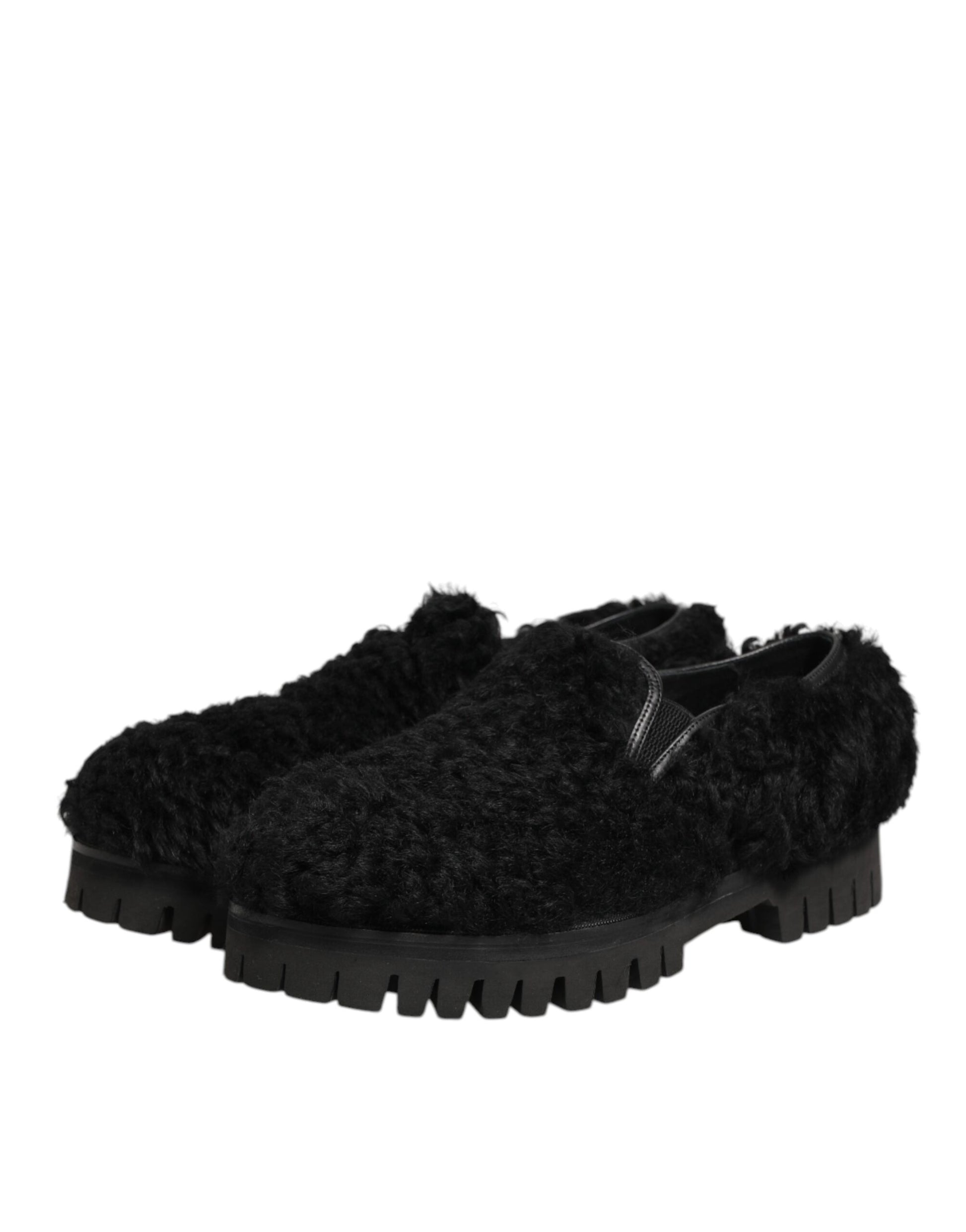 Pair of black fur leather slippers with a chunky sole, featuring the Dolce & Gabbana logo