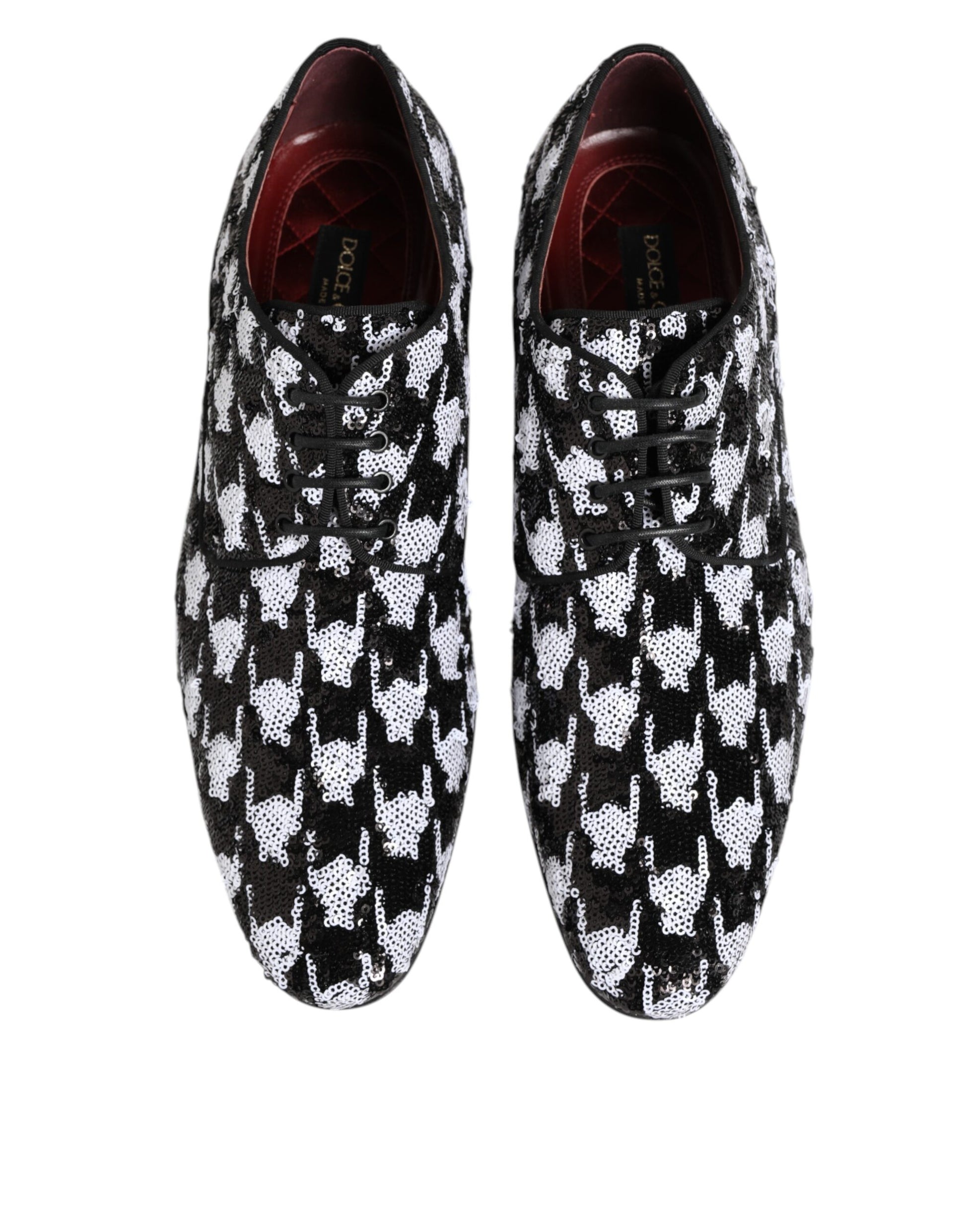 Pair of black and white sequined lace-up derby shoes with a patterned design