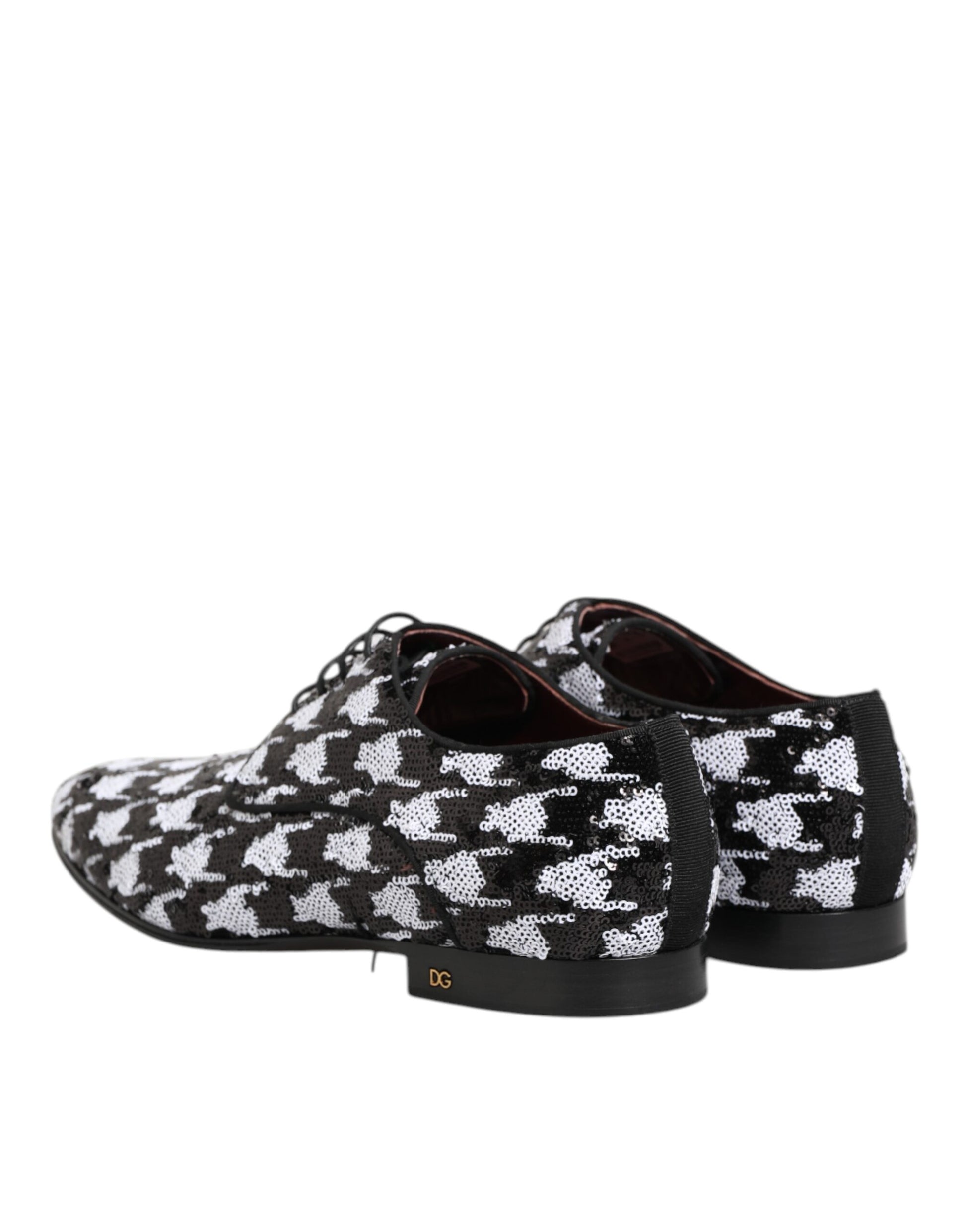 Pair of black and white sequined lace-up derby shoes with a patterned design