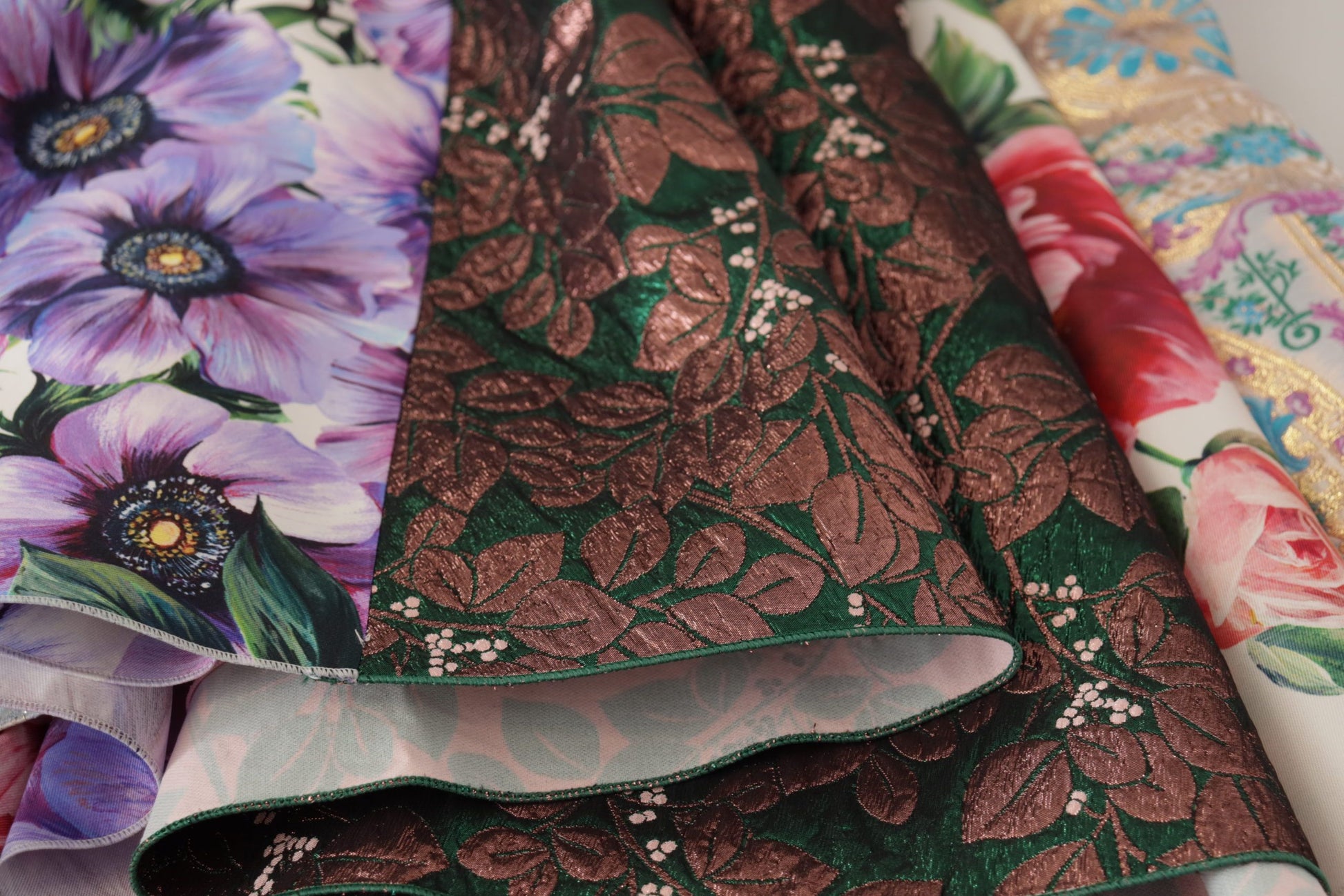 A colorful midi dress with floral patchwork design and silk fabric