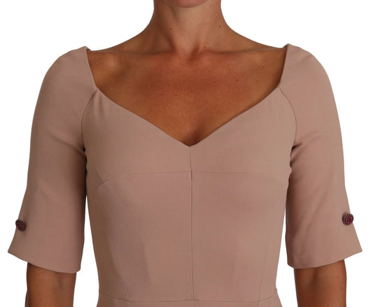 A dusty pink midi sheath dress with crystal buttons from Dolce & Gabbana
