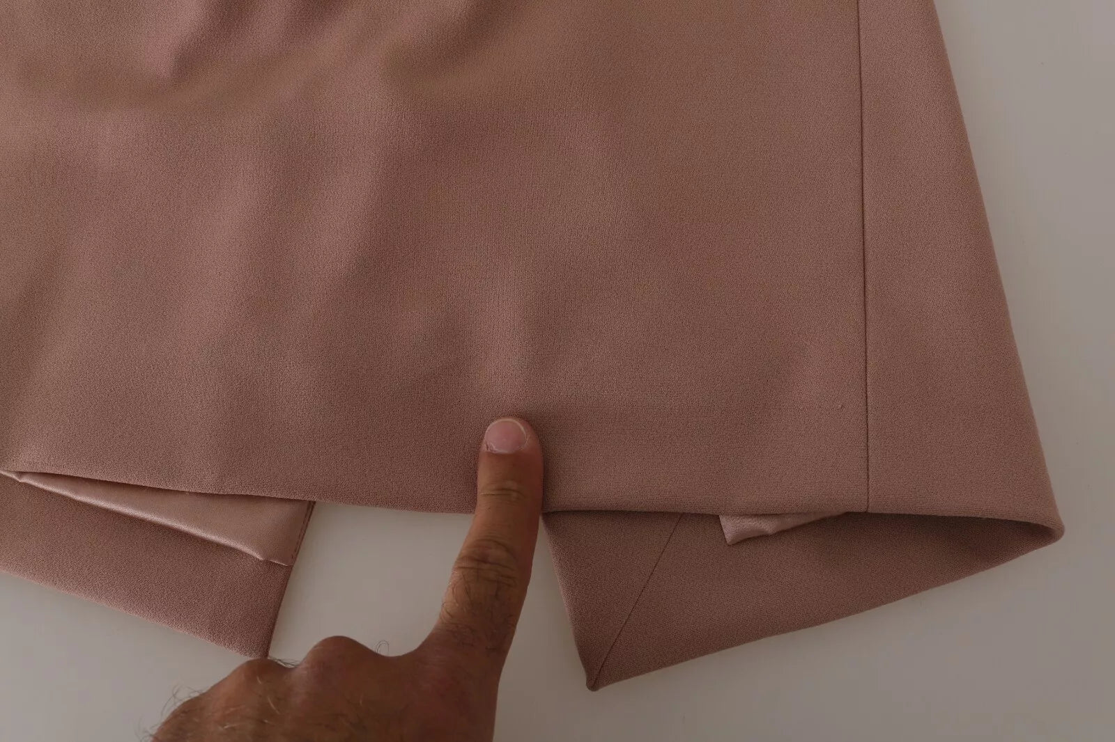 A dusty pink midi sheath dress with crystal buttons from Dolce & Gabbana