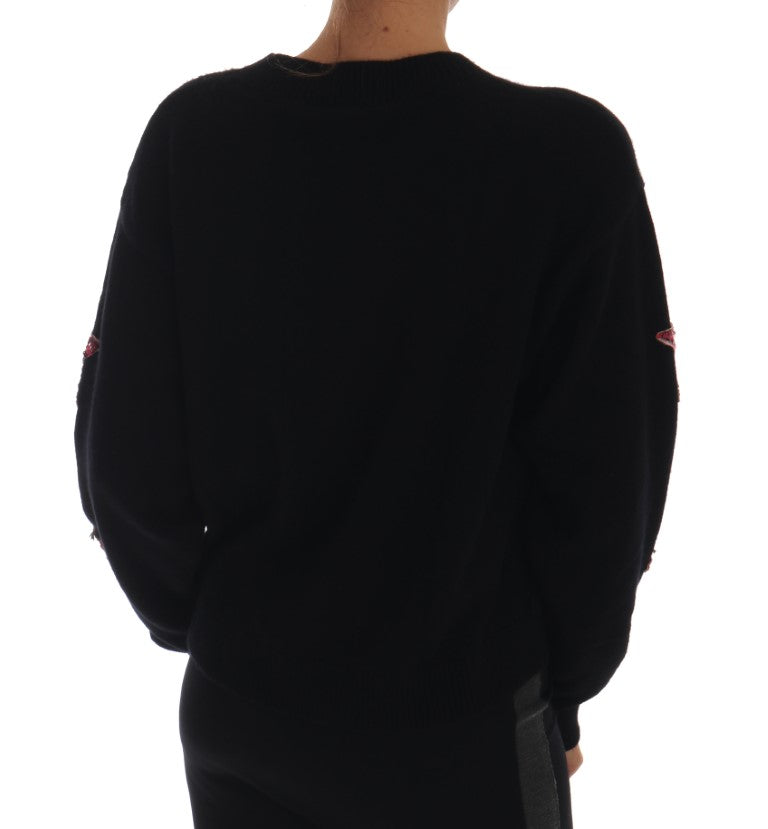 Black long sleeve sweater on person