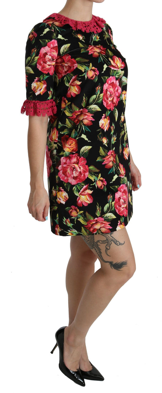 A woman wearing a floral pink lace A-line shift mini dress