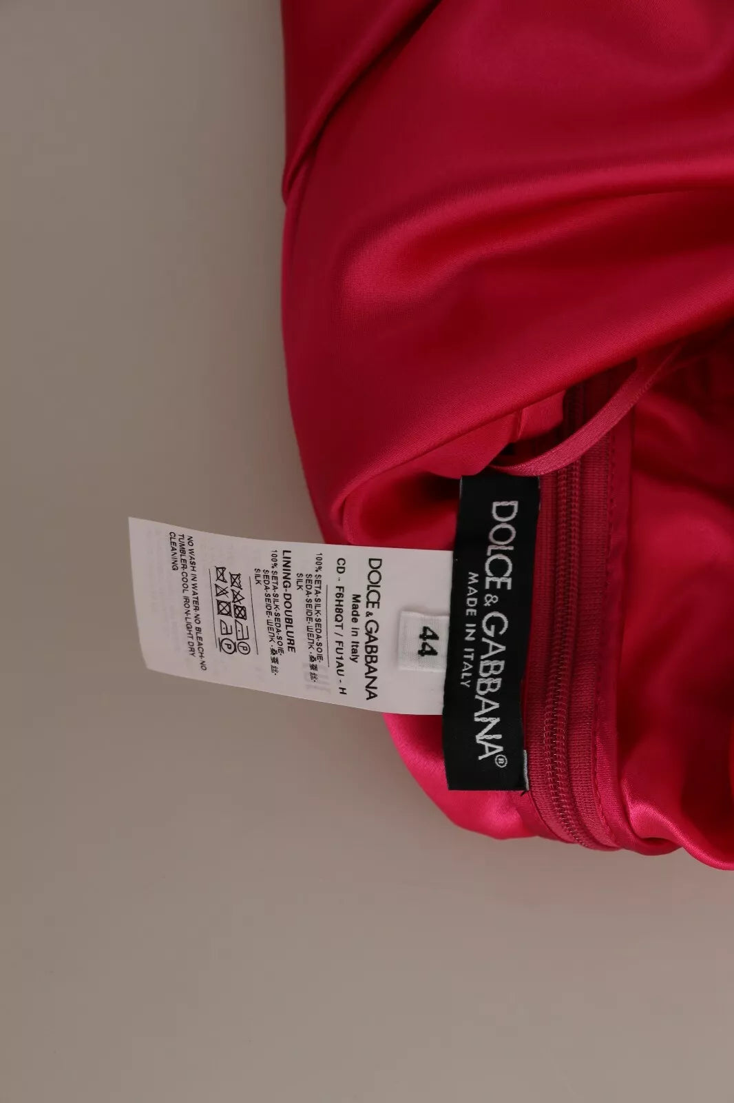 Red garment with tag on waistband
