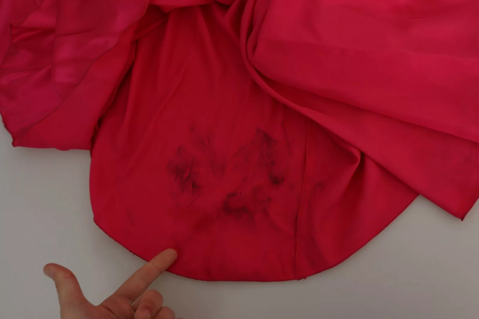 Red fabric with stains on it