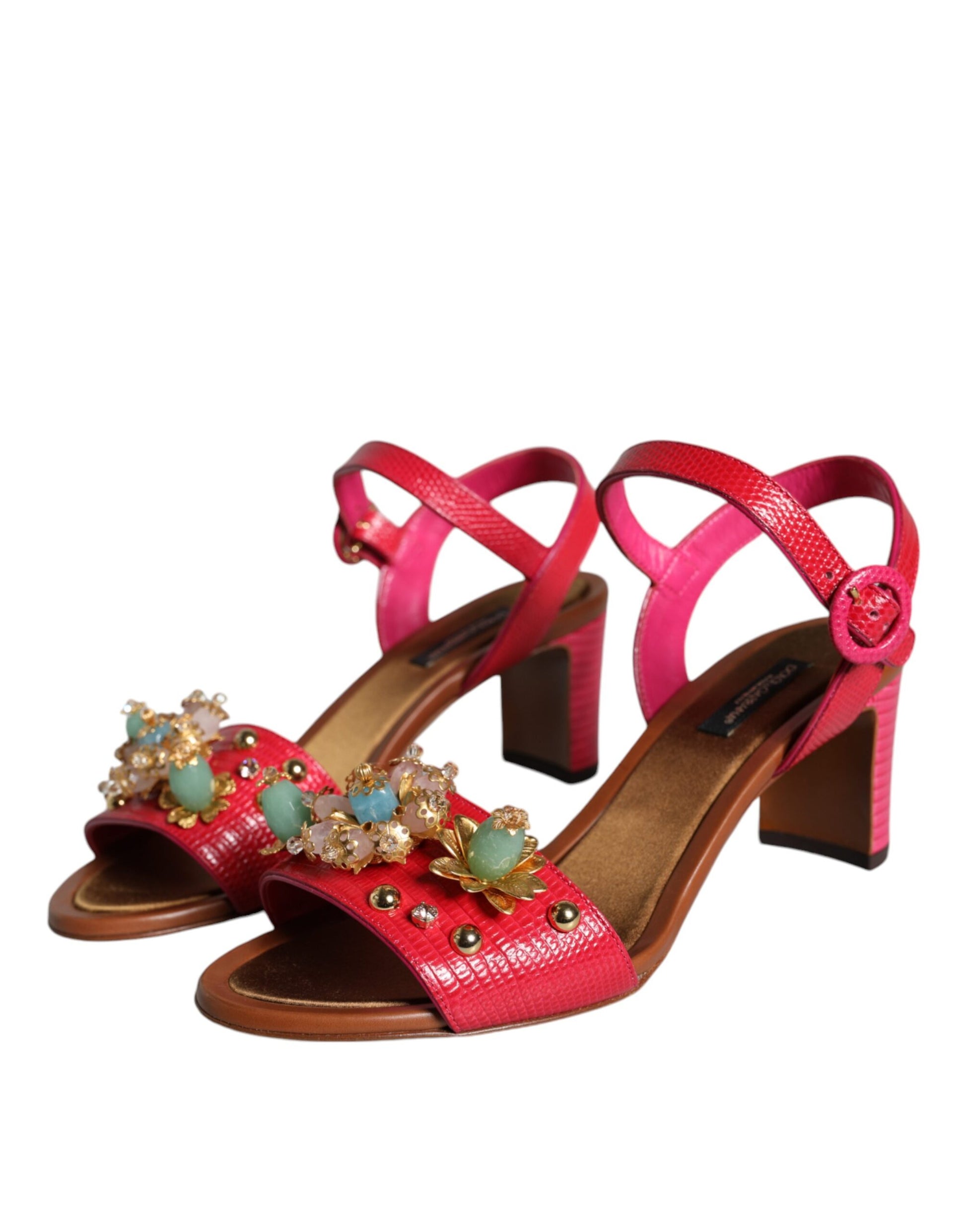 Red strappy sandals with embellishments on heels