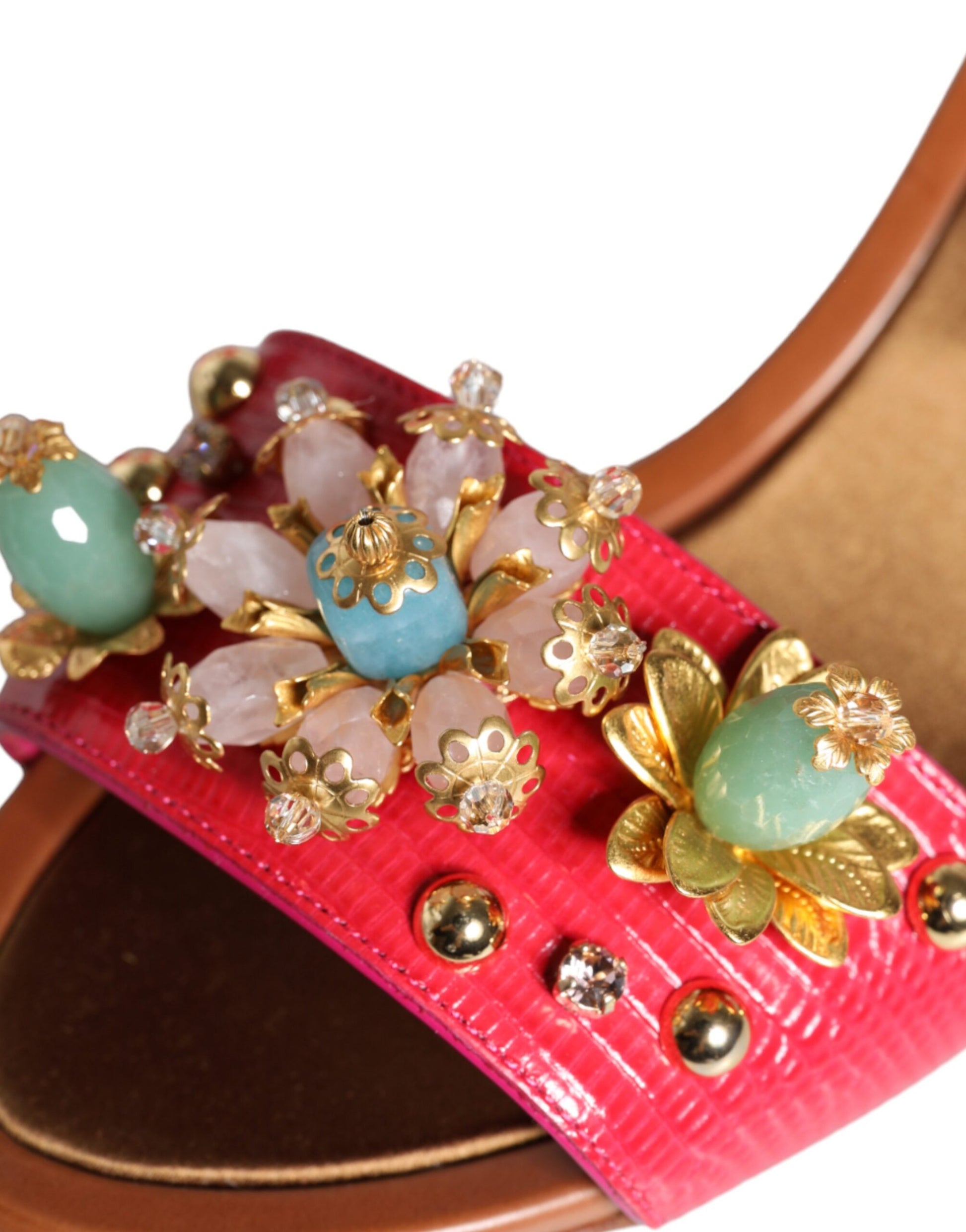 Decorative belt with pink fabric, gold accents, blue stones, and clear crystals