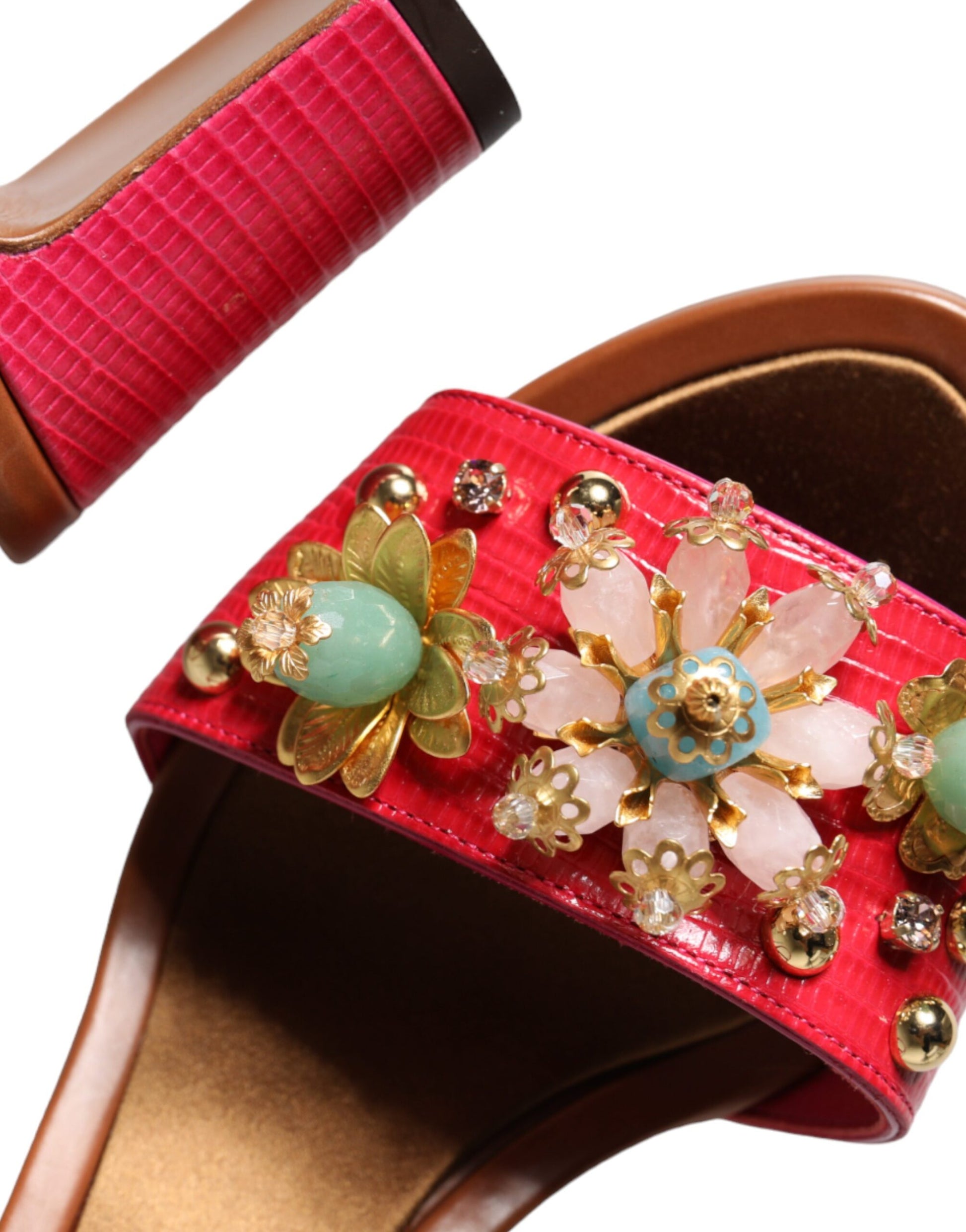 Red sandal with embellished strap featuring gemstones and pearls