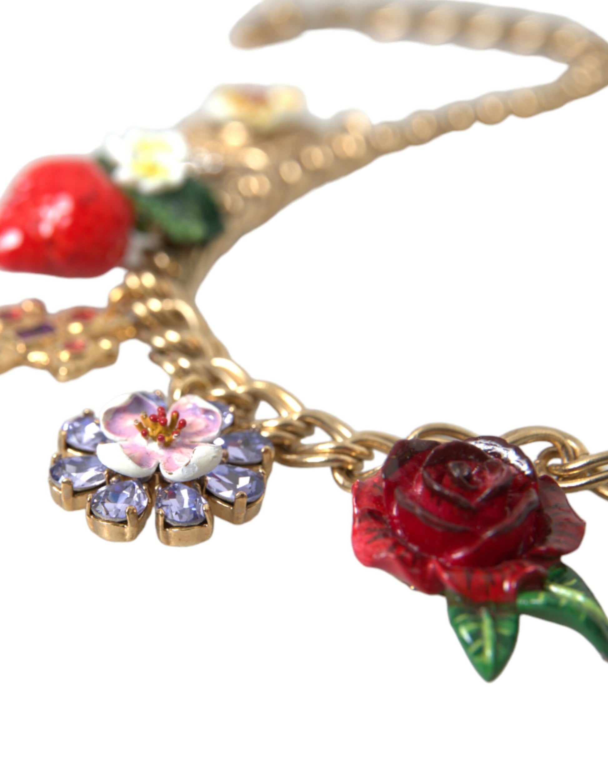 Gold necklace with floral charms including roses and flowers