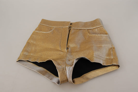 Gold sequined denim shorts with rips at knees