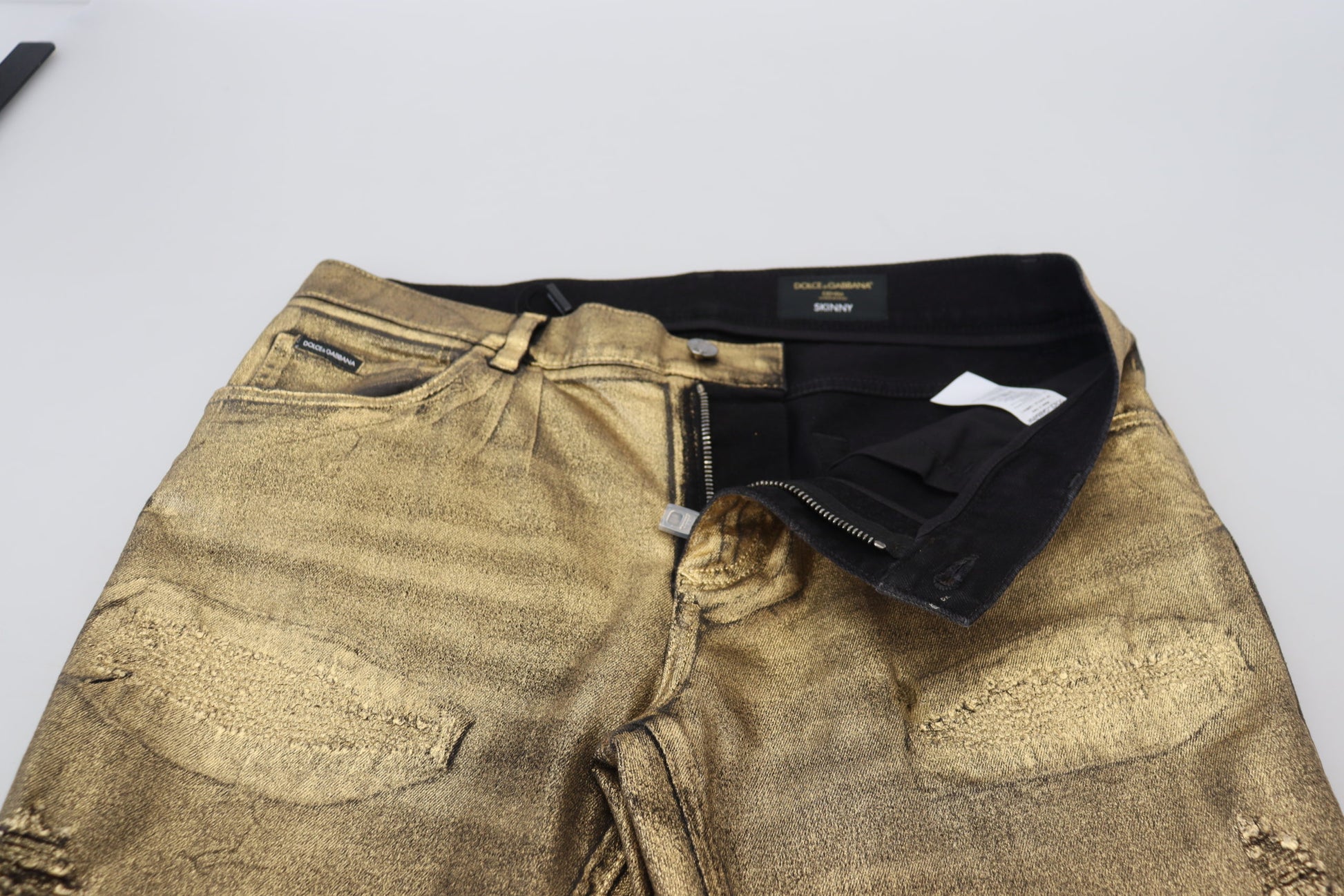 Gold sequin jeans on display