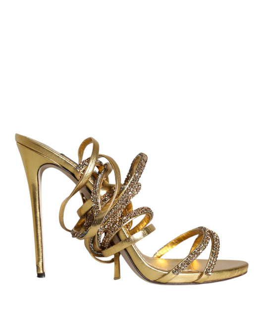 High heel shoe with gold straps and embellishments