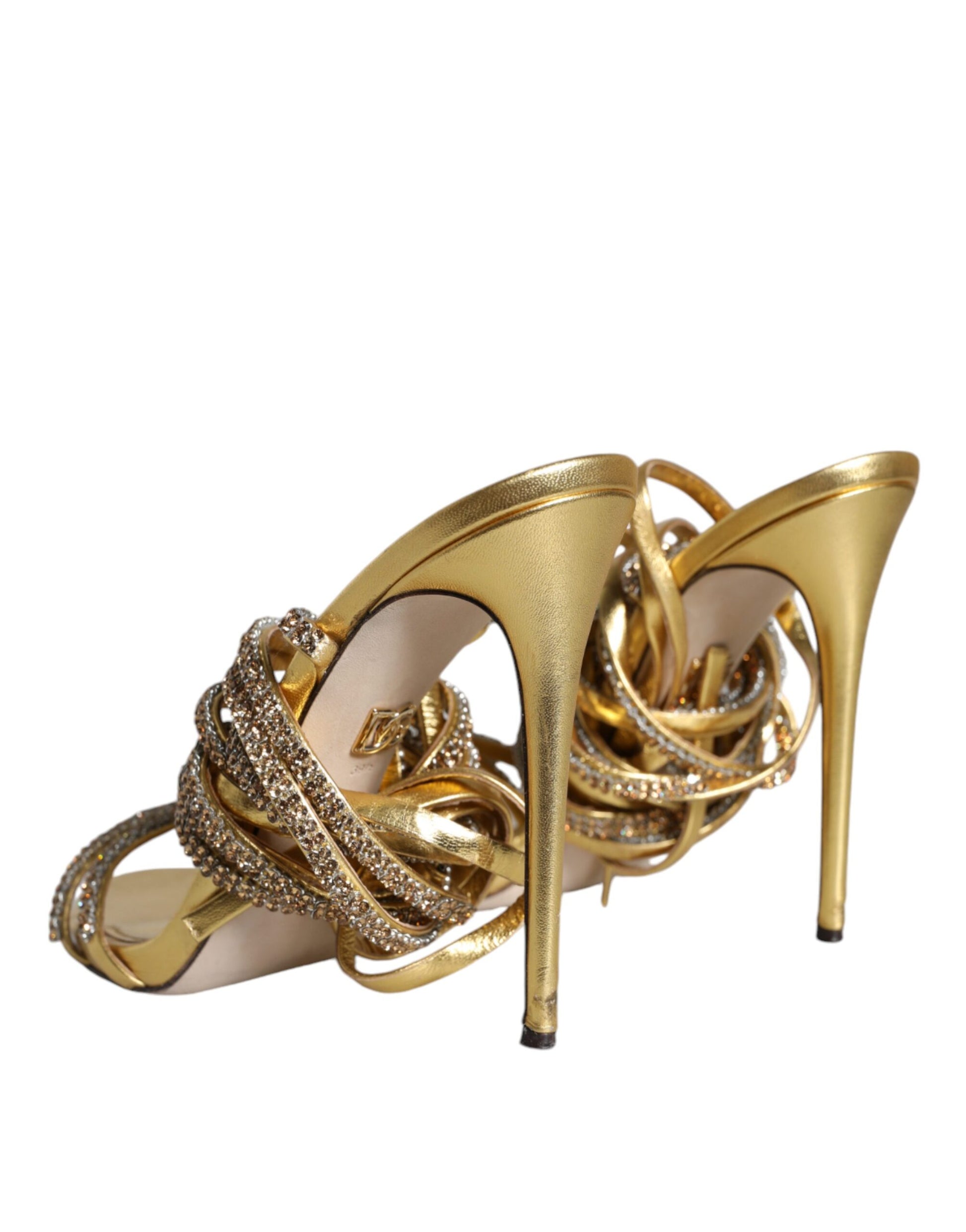 High heel shoe with gold straps and embellishments