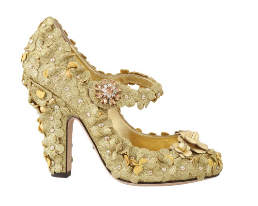 Gold glittery high heel shoes with rhinestones and a bow on top