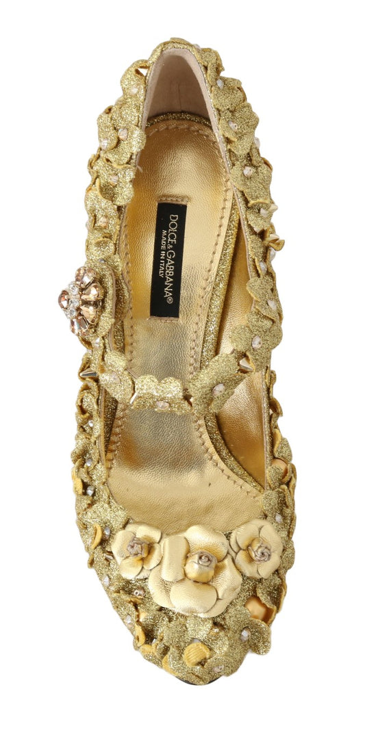 Gold embellished women's shoe with a pointed toe and a strap across the top