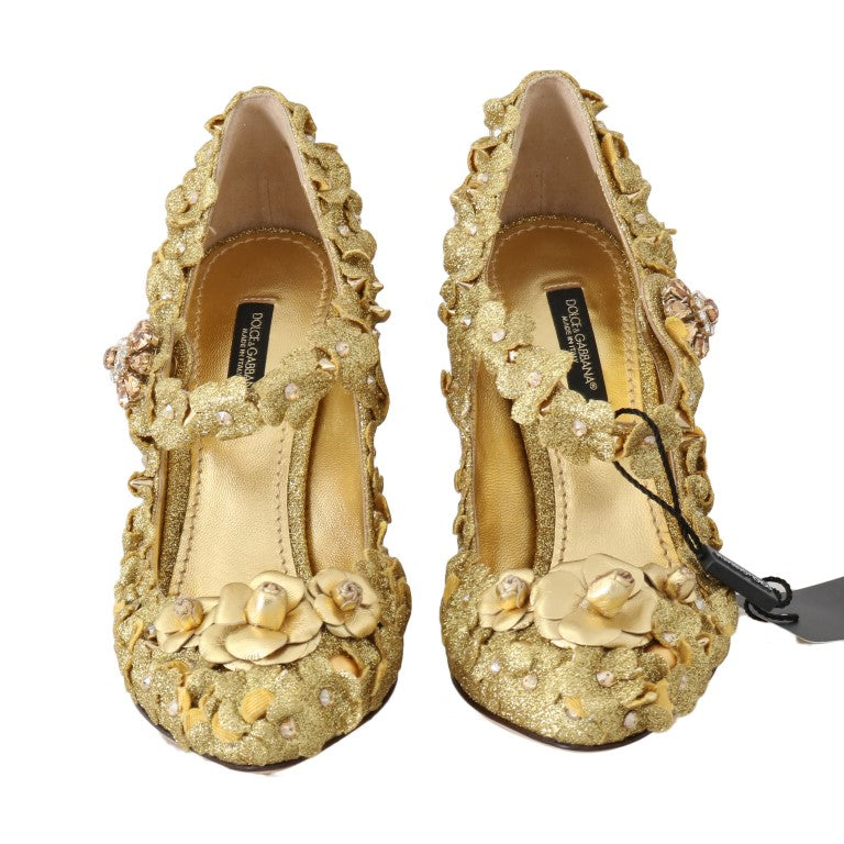 Pair of gold glittery women's shoes with embellishments and a bow on the side