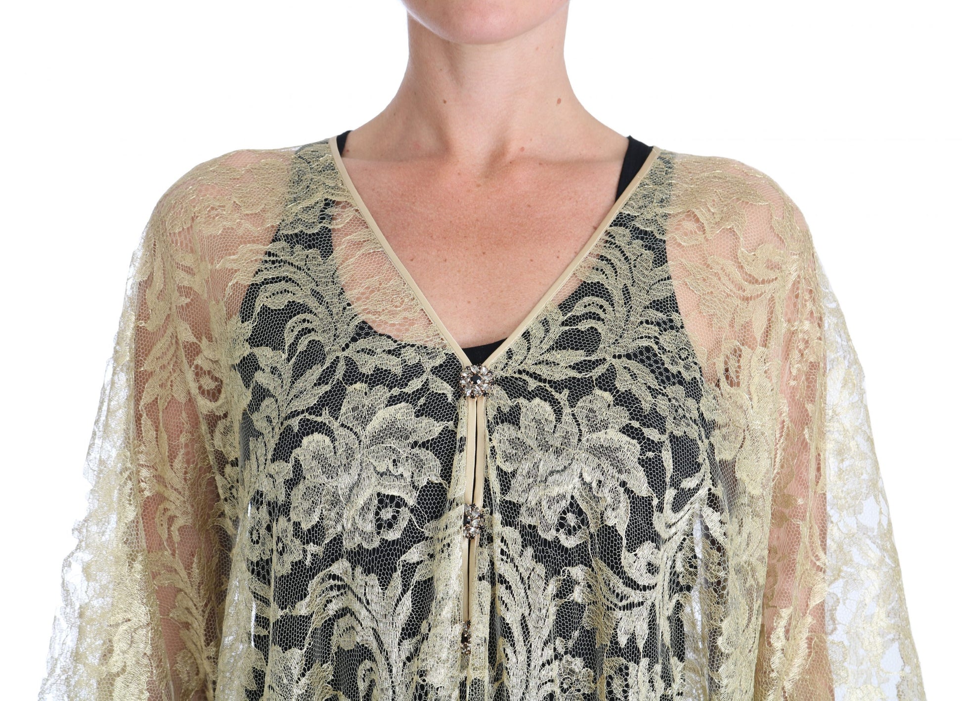 A black and gold lace dress with a cape design, featuring floral patterns and crystals