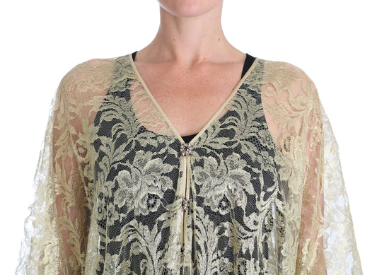 A black and gold lace dress with a cape design, featuring floral patterns and crystals
