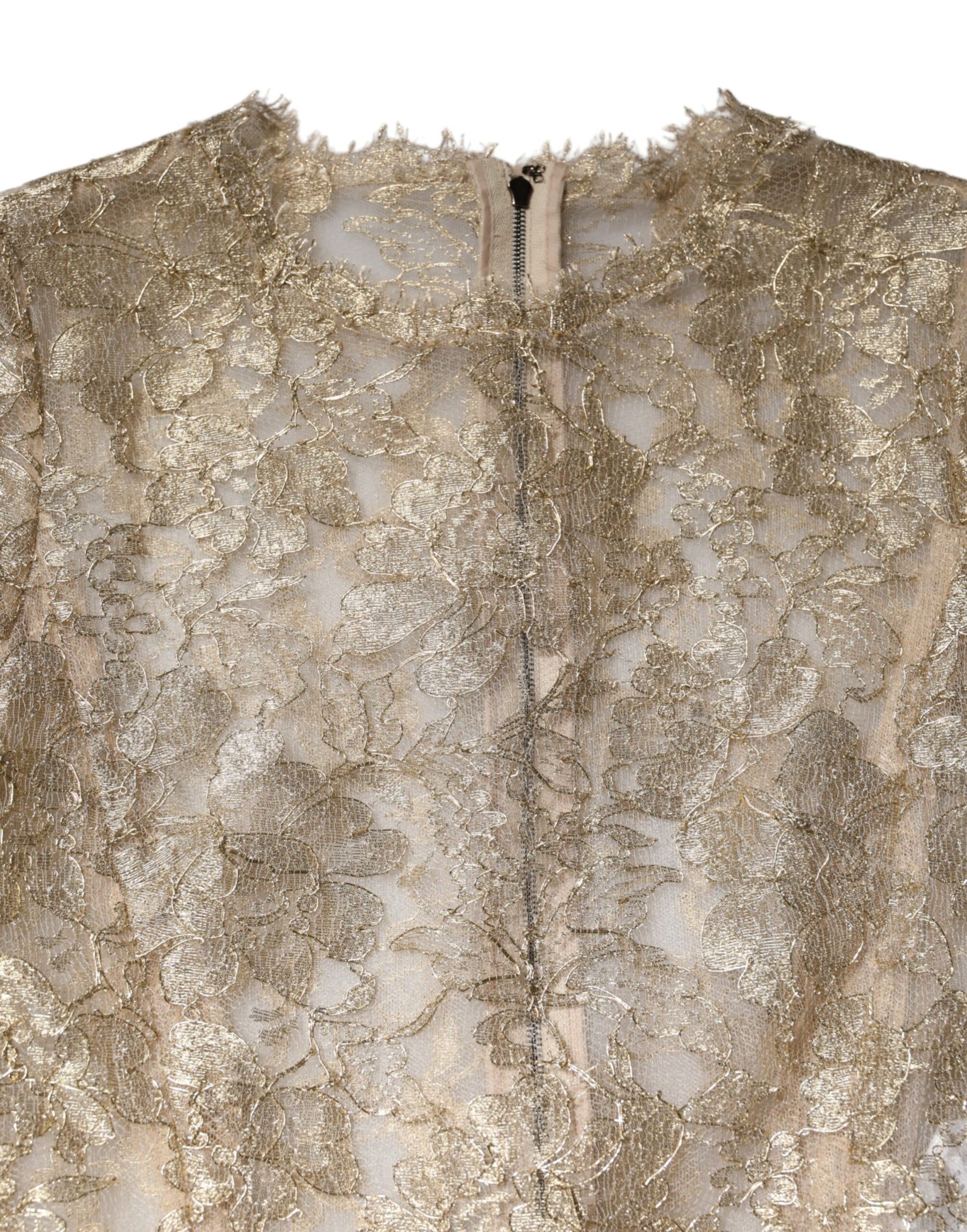 A gold floral lace long sleeve dress with a fit and flare silhouette