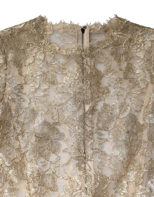 A gold floral lace long sleeve dress with a fit and flare silhouette