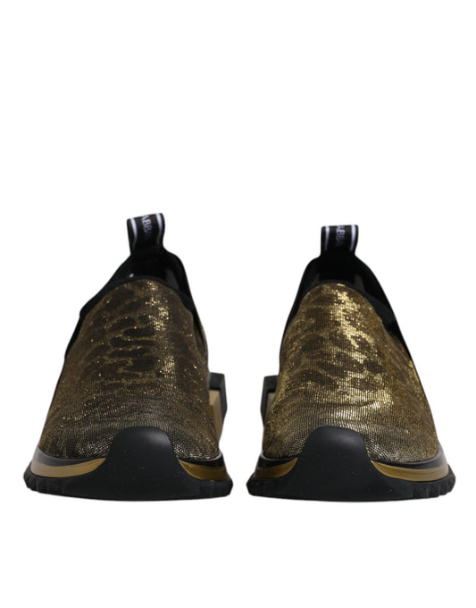 Pair of gold glitter leopard print sneakers with black laces and soles