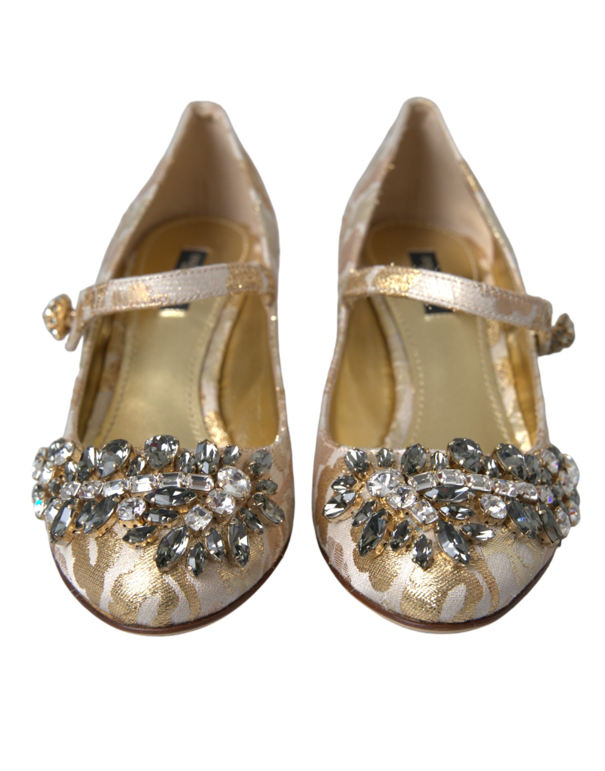Pair of gold glittery baby shoes with bow on top
