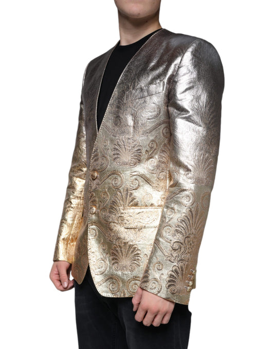 A gold jacquard single-breasted blazer with intricate patterns