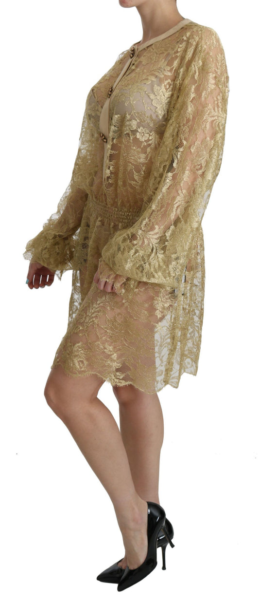 A gold lace see through knee length dress with long sleeves