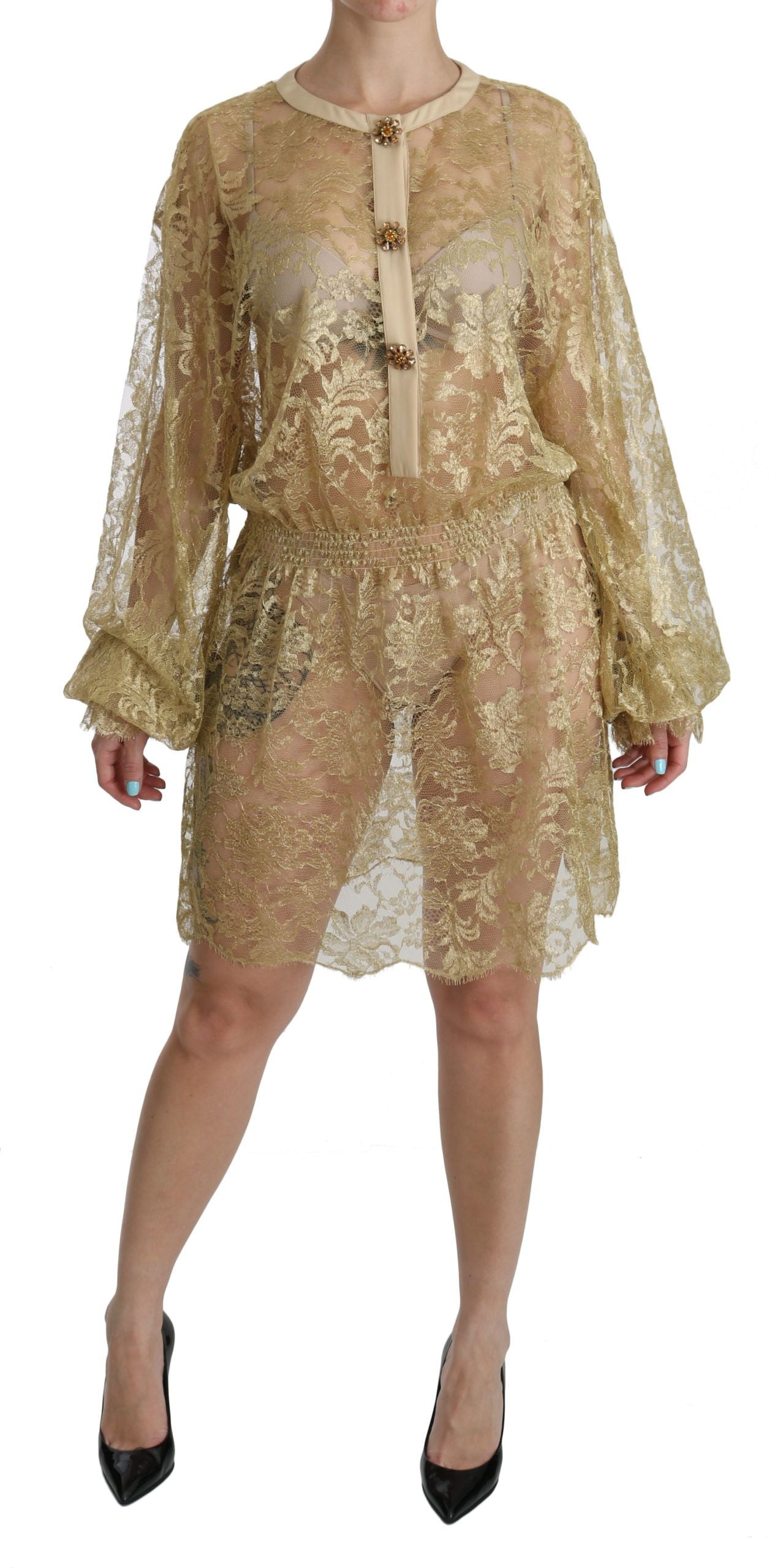 A gold lace see through a-line knee length dress by Dolce & Gabbana