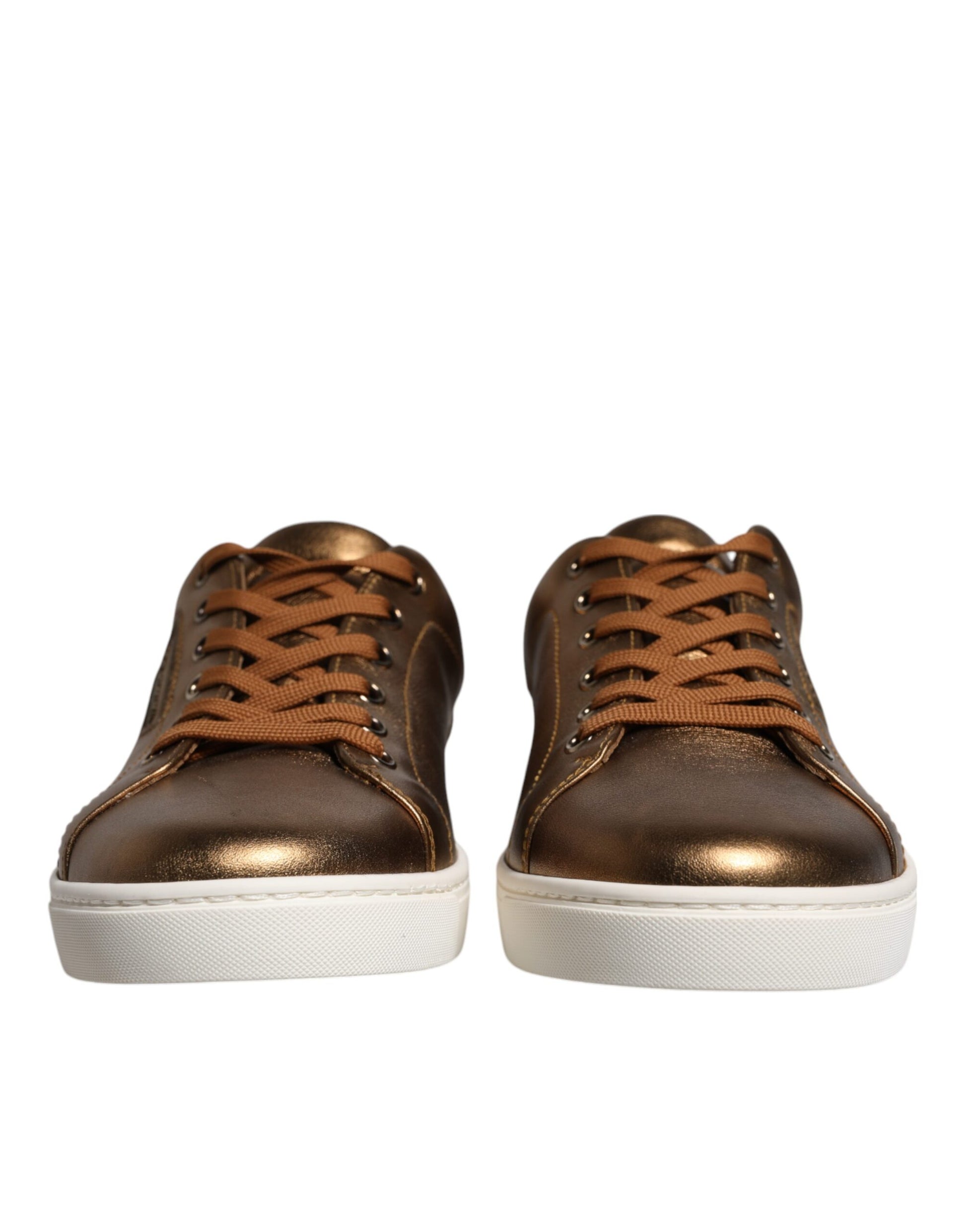 Pair of gold leather sneakers with brown laces and logo on side, designed by Dolce & Gabbana