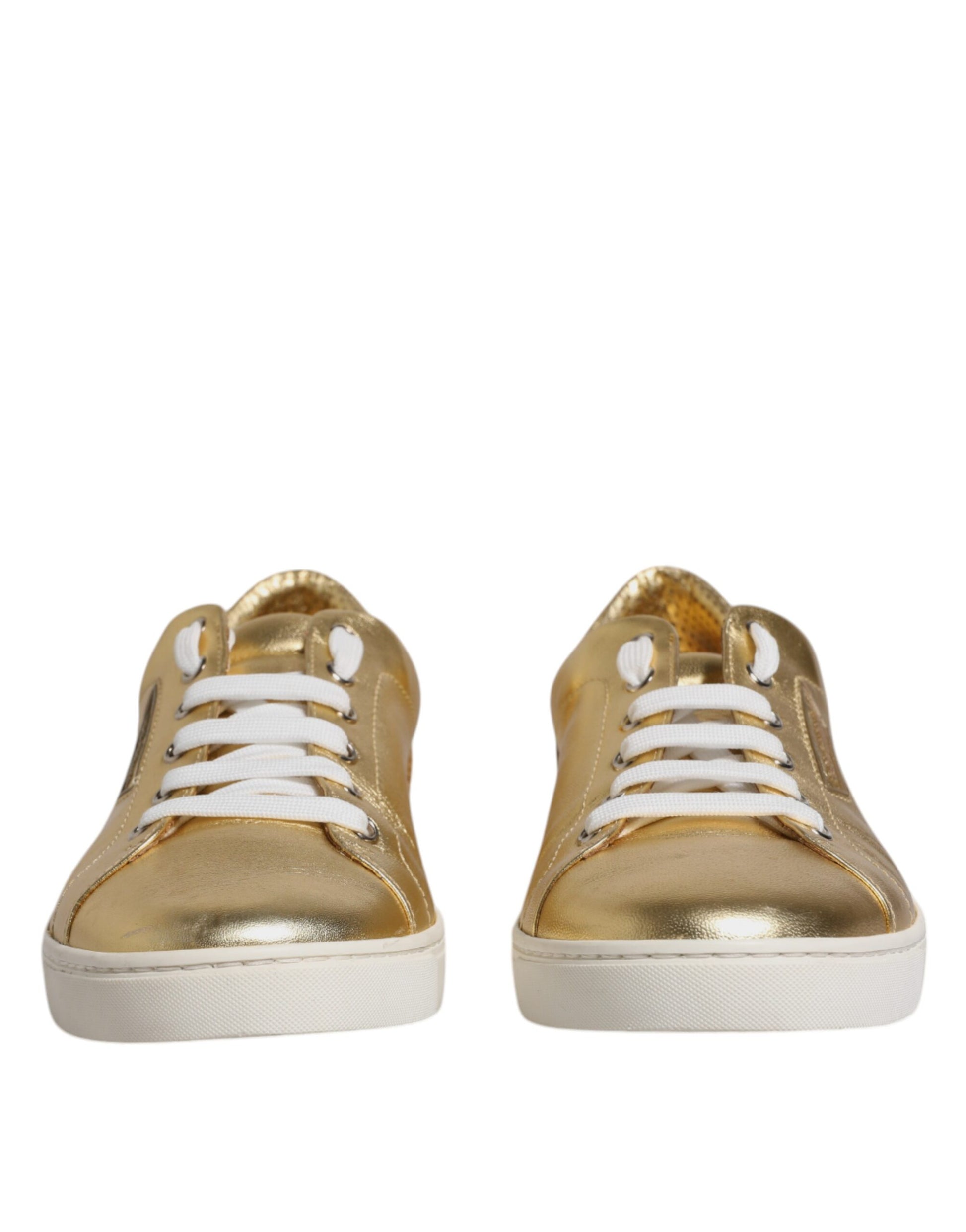 Gold glittery sneakers with white laces and soles
